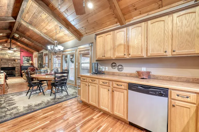 a bed room with two beds and a chandelier