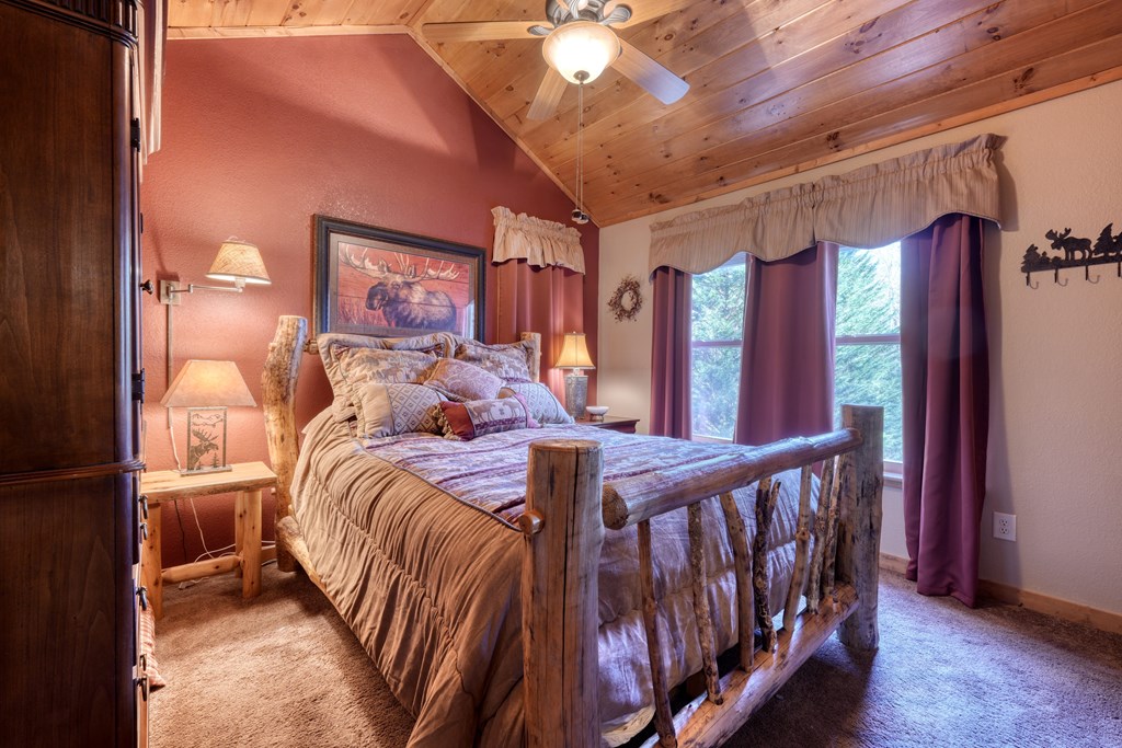 518 Rizzitello Lane Blairsville, GA 30512 - Photo 18 of 44 a bed room with two beds and a chandelier