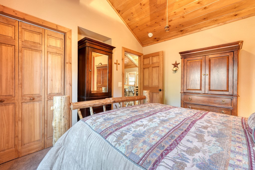 518 Rizzitello Lane Blairsville, GA 30512 - Photo 19 of 44 a bedroom with a bed and a window