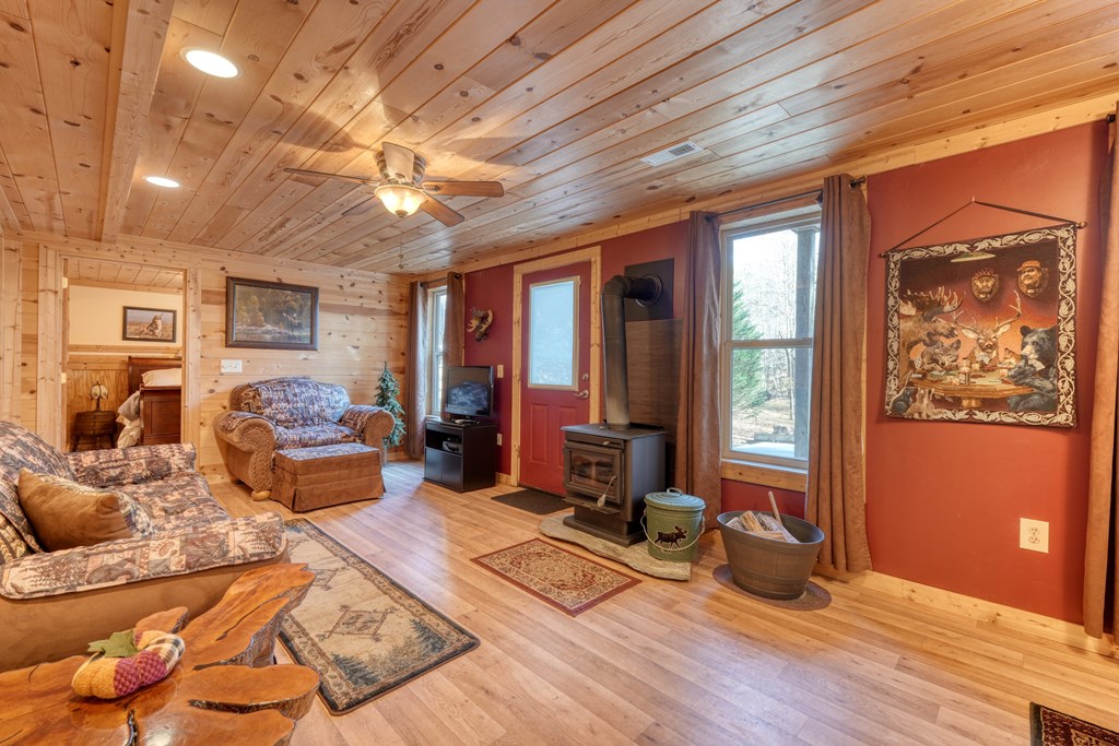 518 Rizzitello Lane Blairsville, GA 30512 - Photo 21 of 44 a living room with furniture large window and wooden floor