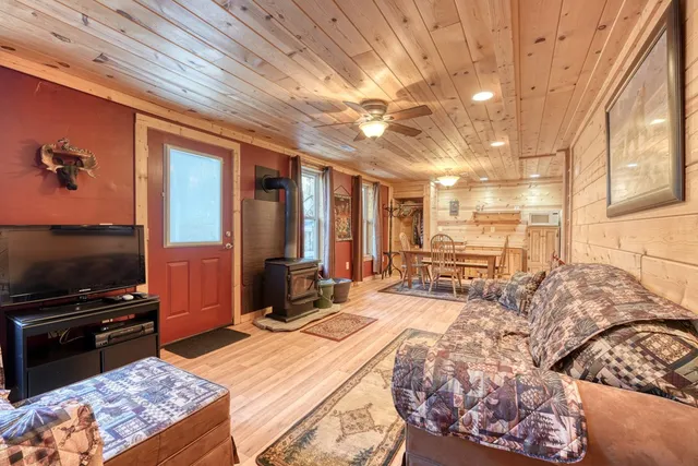 a living room with couch and a flat screen tv