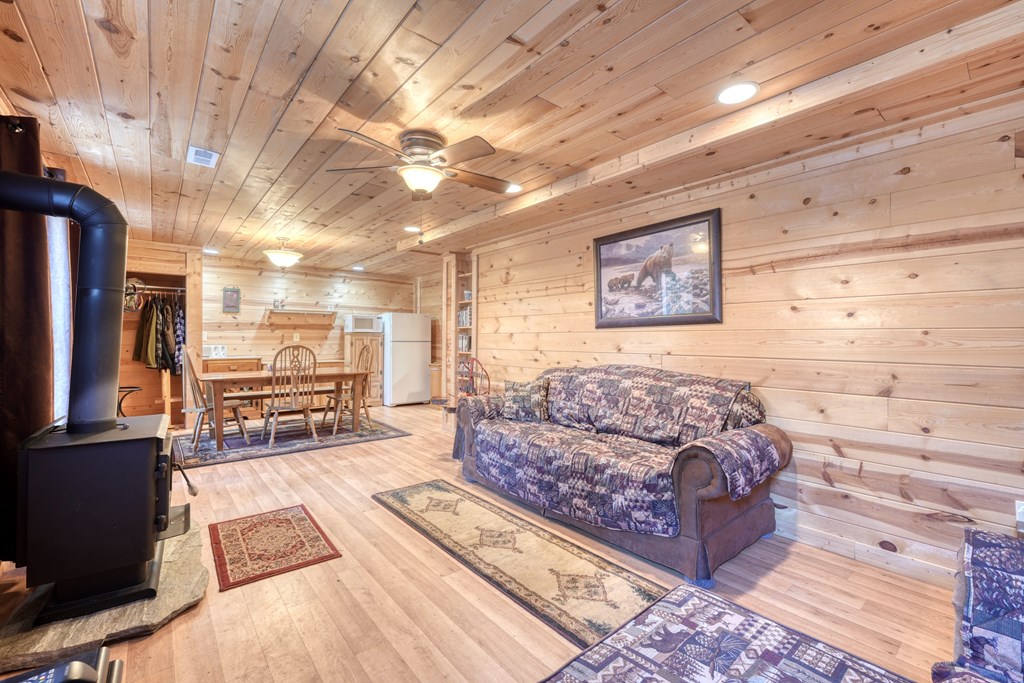 518 Rizzitello Lane Blairsville, GA 30512 - Photo 23 of 44 a living room with couch and a flat screen tv