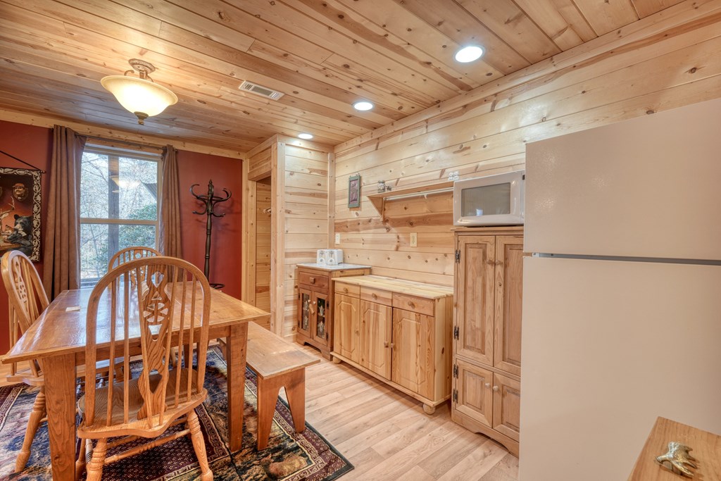 518 Rizzitello Lane Blairsville, GA 30512 - Photo 26 of 44 a open kitchen with stainless steel appliances granite countertop a stove and a refrigerator