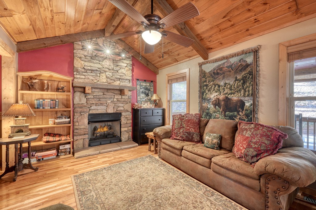 518 Rizzitello Lane Blairsville, GA 30512 - Photo 5 of 44 a living room with furniture a fireplace and a flat screen tv