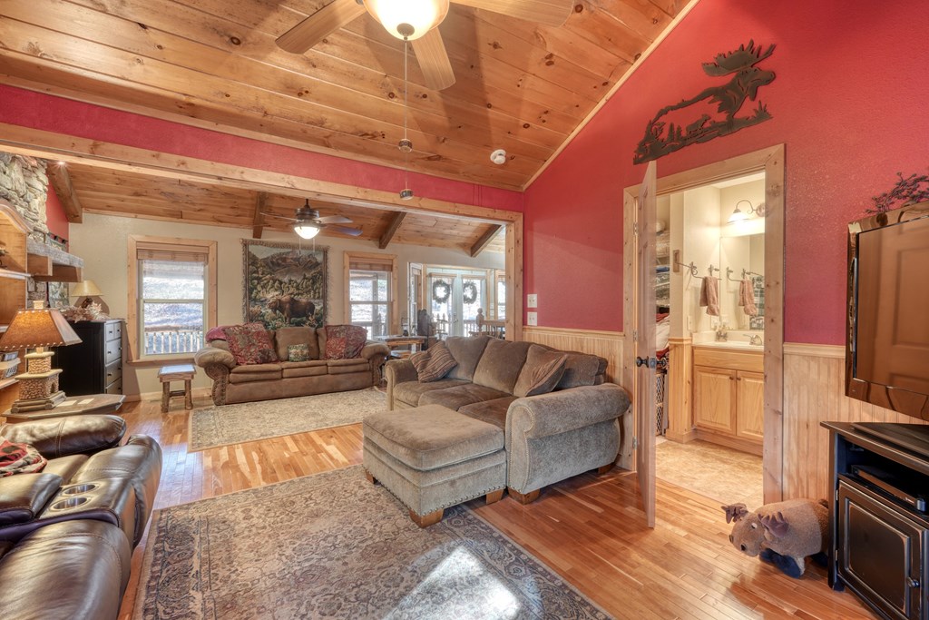 518 Rizzitello Lane Blairsville, GA 30512 - Photo 9 of 44 a living room with furniture and a flat screen tv
