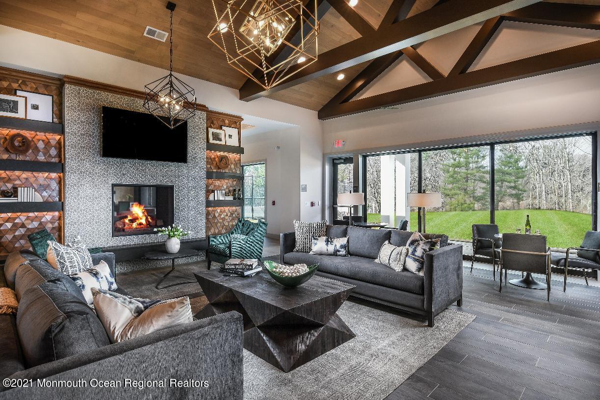 5 Old Eagle Road Freehold, NJ 07728 - Photo 16 of 17 a living room with furniture fireplace and a large window