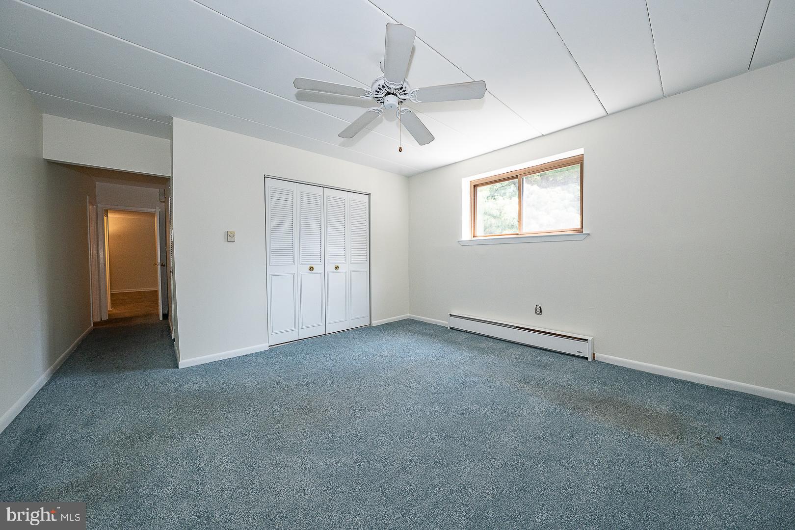 400 Glendale Road, Unit 44 Havertown, PA 19083 - Photo 11 of 29 an empty room with a ceiling fan and a window