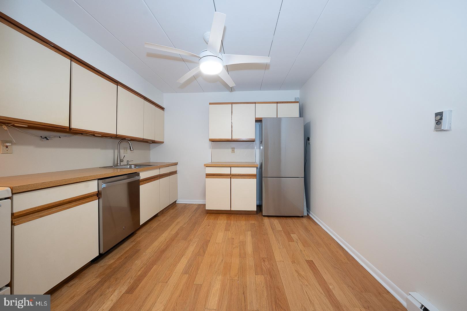 400 Glendale Road, Unit 44 Havertown, PA 19083 - Photo 17 of 29 a kitchen with a sink a refrigerator and cabinets