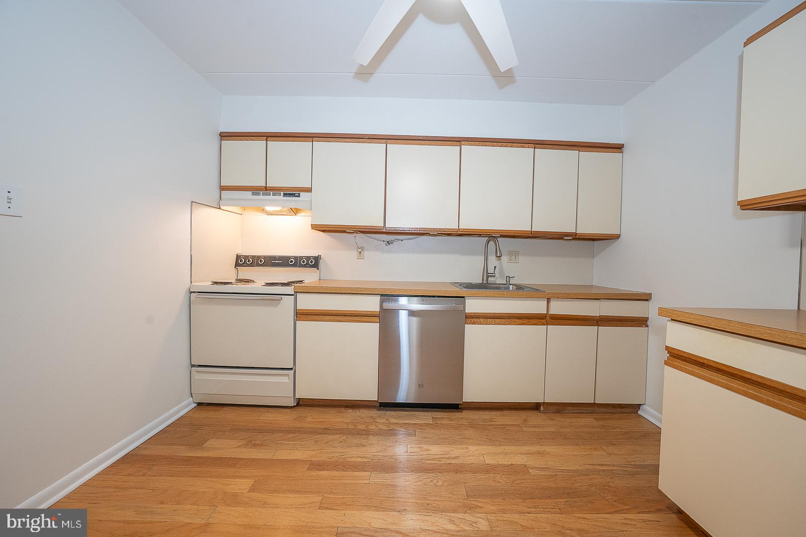 400 Glendale Road, Unit 44 Havertown, PA 19083 - Photo 18 of 29 a kitchen with white cabinets and white appliances