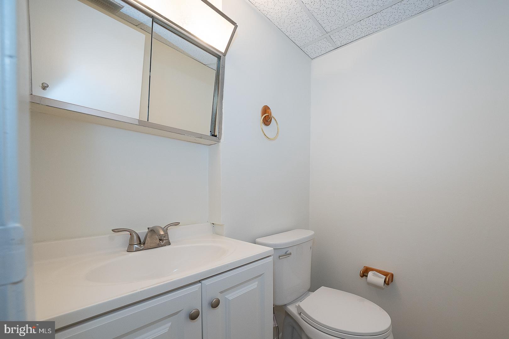400 Glendale Road, Unit 44 Havertown, PA 19083 - Photo 21 of 29 a bathroom with a sink a toilet and a mirror