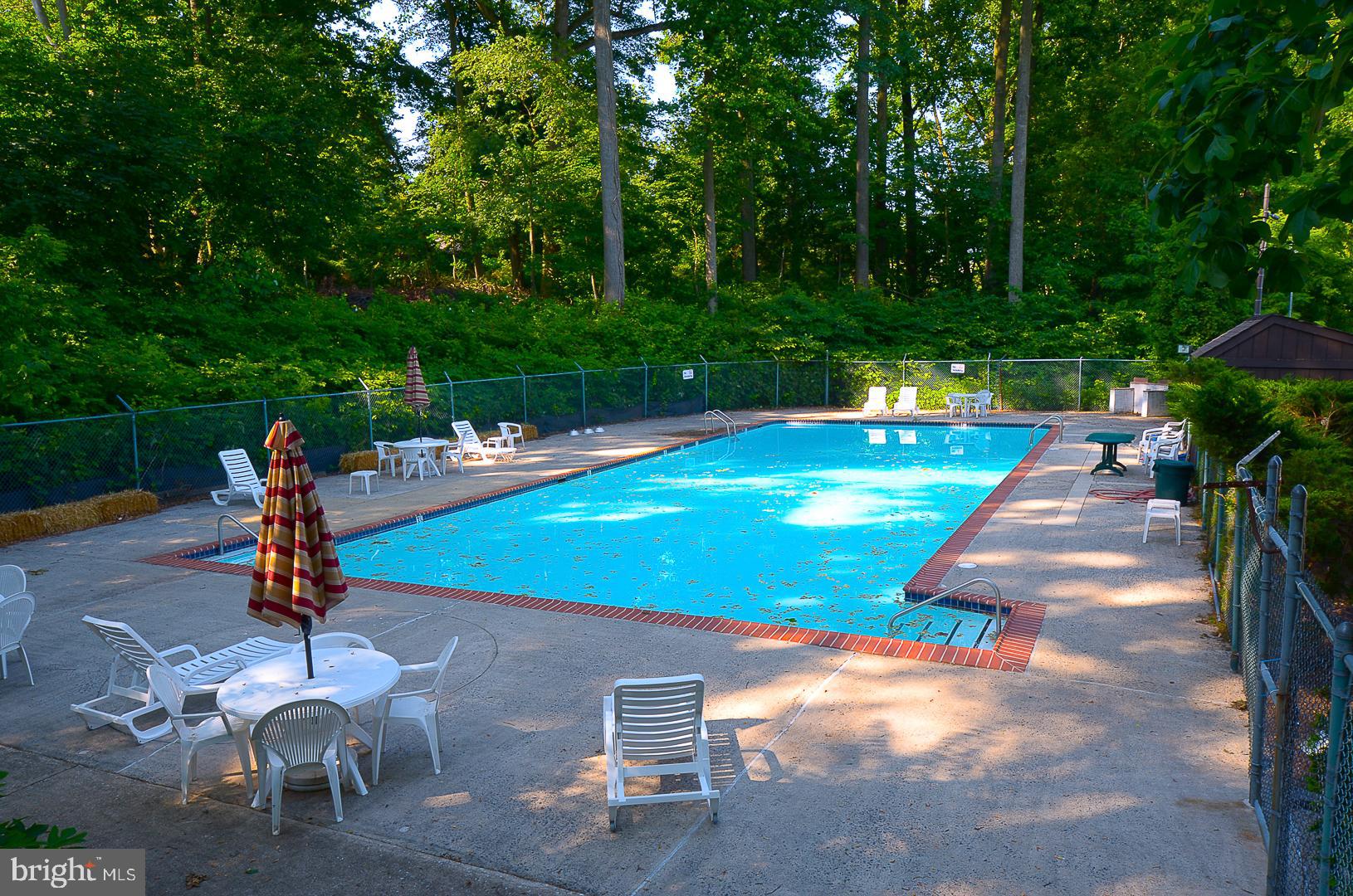 400 Glendale Road, Unit 44 Havertown, PA 19083 - Photo 25 of 29 a view of a backyard with swimming pool and sitting area