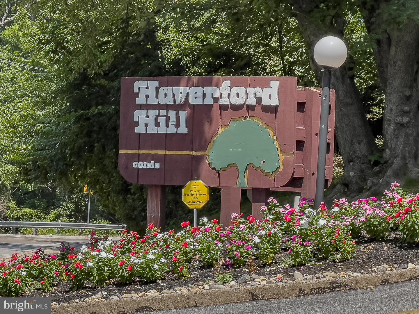 400 Glendale Road, Unit 44 Havertown, PA 19083 - Photo 29 of 29 a view of a bunch of flowers and flowers in front of yellow house