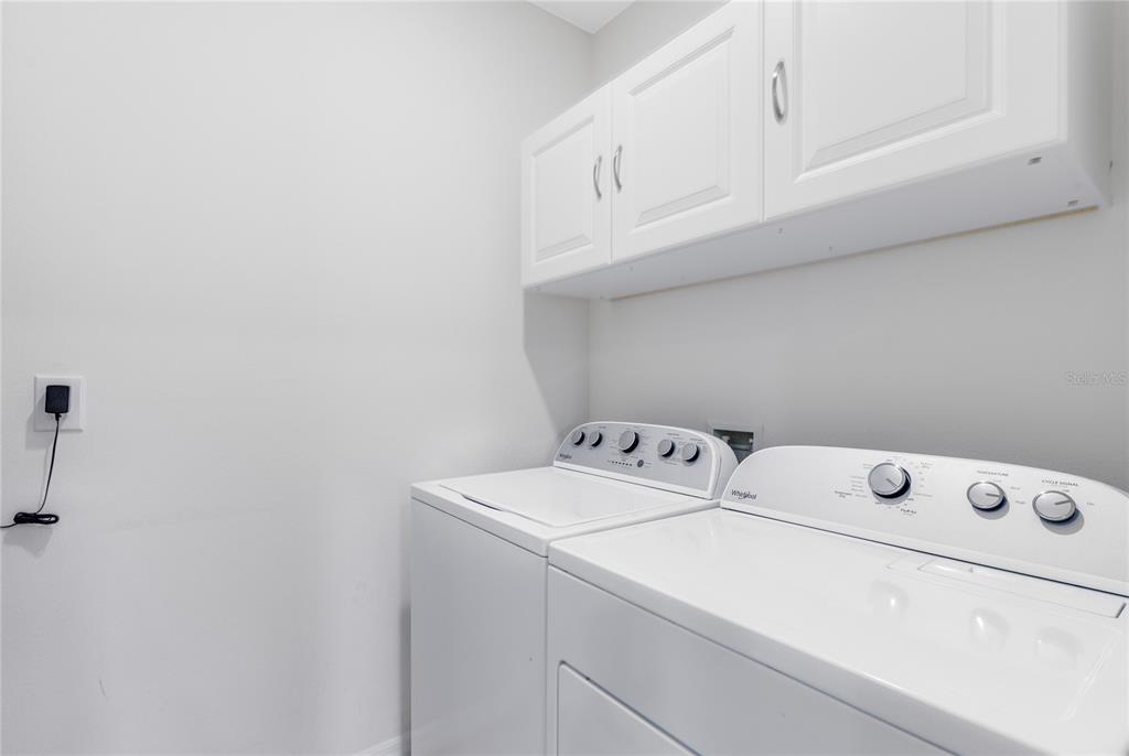 1600 Spray Terrace St. Cloud, FL 34771 - Photo 19 of 30 a utility room with dryer and washer