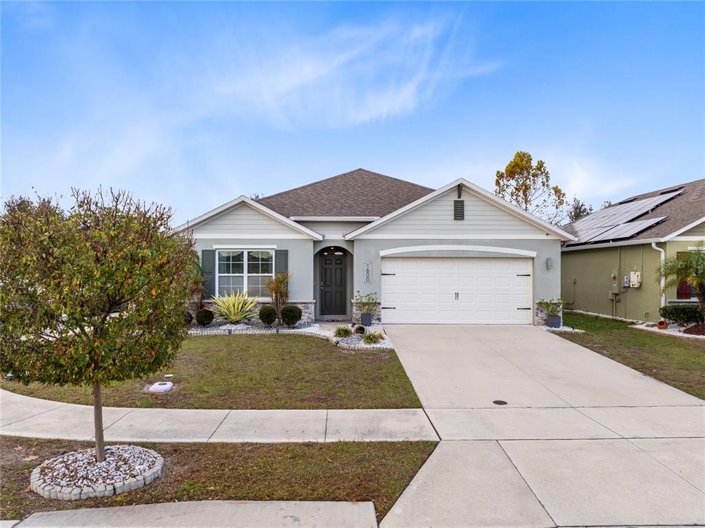 1600 Spray Terrace St. Cloud, FL 34771 - Photo 28 of 30 a front view of a house with a yard