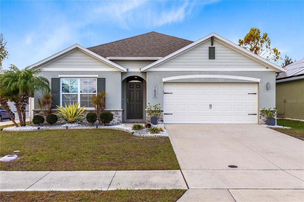 1600 Spray Terrace St. Cloud, FL 34771 - Photo 29 of 30 a view of a house with backyard and sitting area