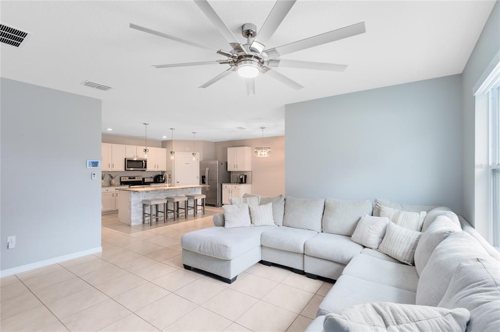 1600 Spray Terrace St. Cloud, FL 34771 - Photo 9 of 30 a living room with furniture and a table