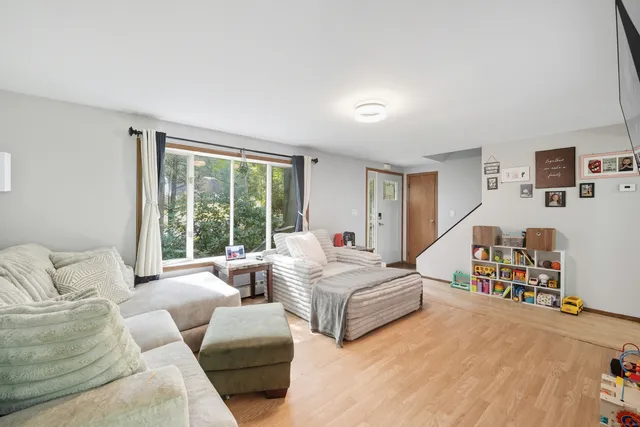 a bedroom with two beds and a large window