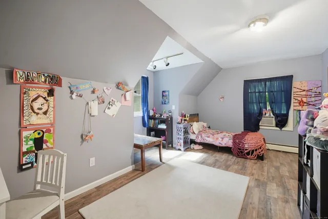 a bedroom with furniture and a bed