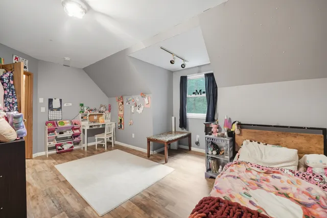 a bedroom with furniture and a bed