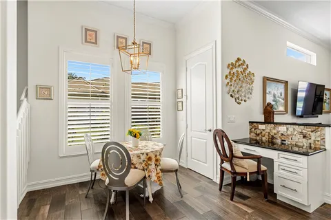 a view of a dining room with furniture and windows
