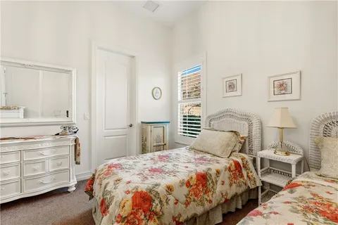 a living room with furniture a rug and a window