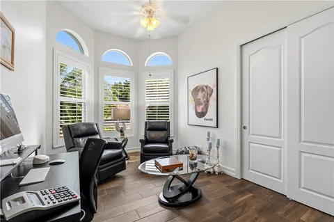 a view of a storage and utility room with closet dryer