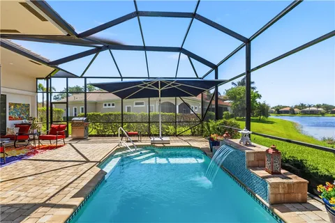 a view of a patio with a table chairs and a table
