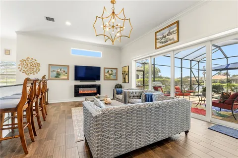 a living room with furniture rug and wooden floor