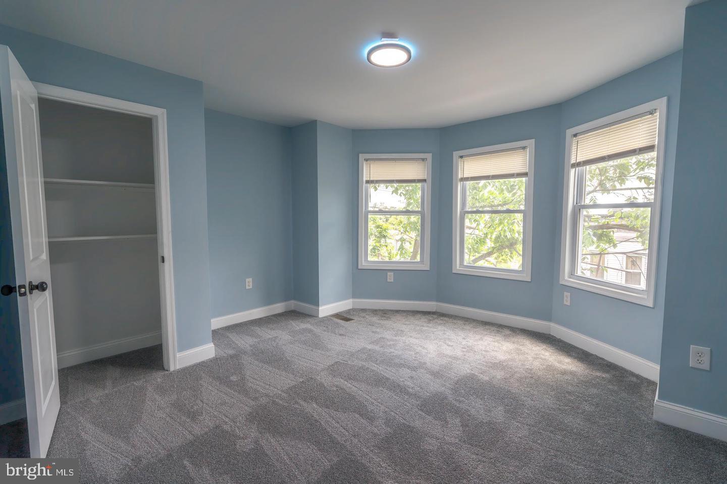 3211 Baker Street Baltimore, MD 21216 - Photo 12 of 20 a view of an empty room with a window
