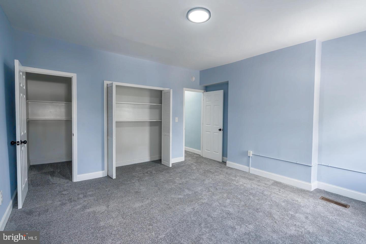 3211 Baker Street Baltimore, MD 21216 - Photo 17 of 20 a view of an empty room and closet area