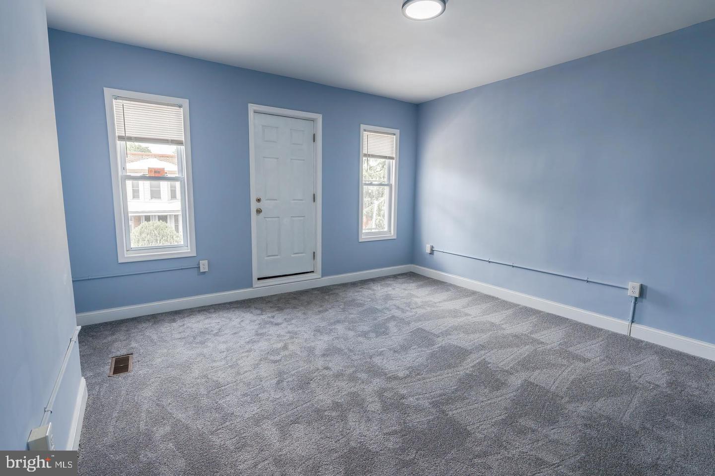 3211 Baker Street Baltimore, MD 21216 - Photo 18 of 20 an empty room with windows