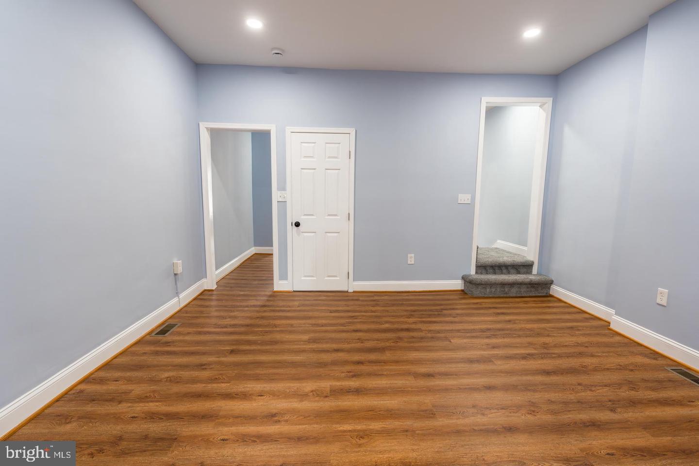 3211 Baker Street Baltimore, MD 21216 - Photo 7 of 20 a view of room with wooden floor