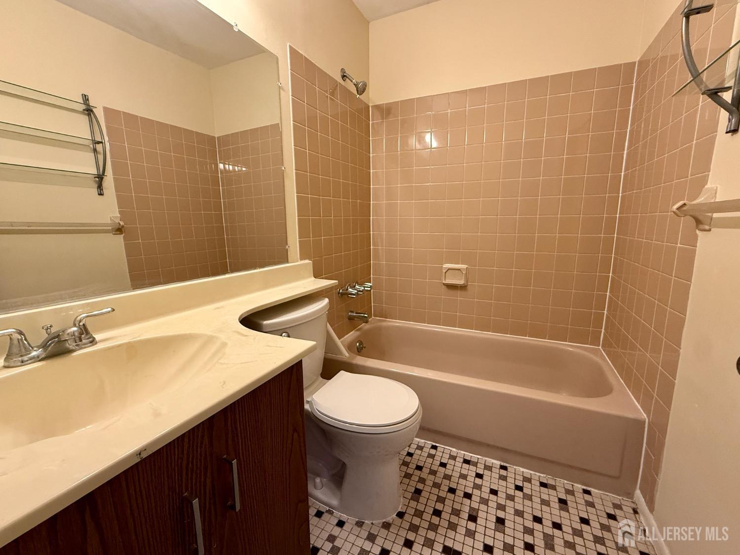 136 Westgate Drive Edison, NJ 08820 - Photo 13 of 17 a bathroom with a sink a toilet and shower