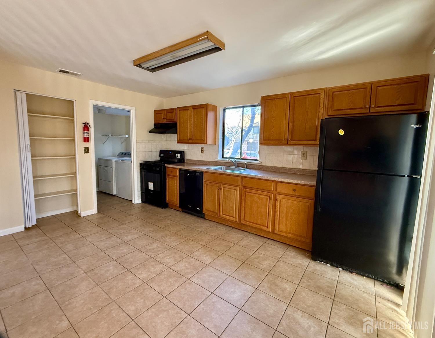 136 Westgate Drive Edison, NJ 08820 - Photo 4 of 17 a kitchen with stainless steel appliances granite countertop a refrigerator and a sink