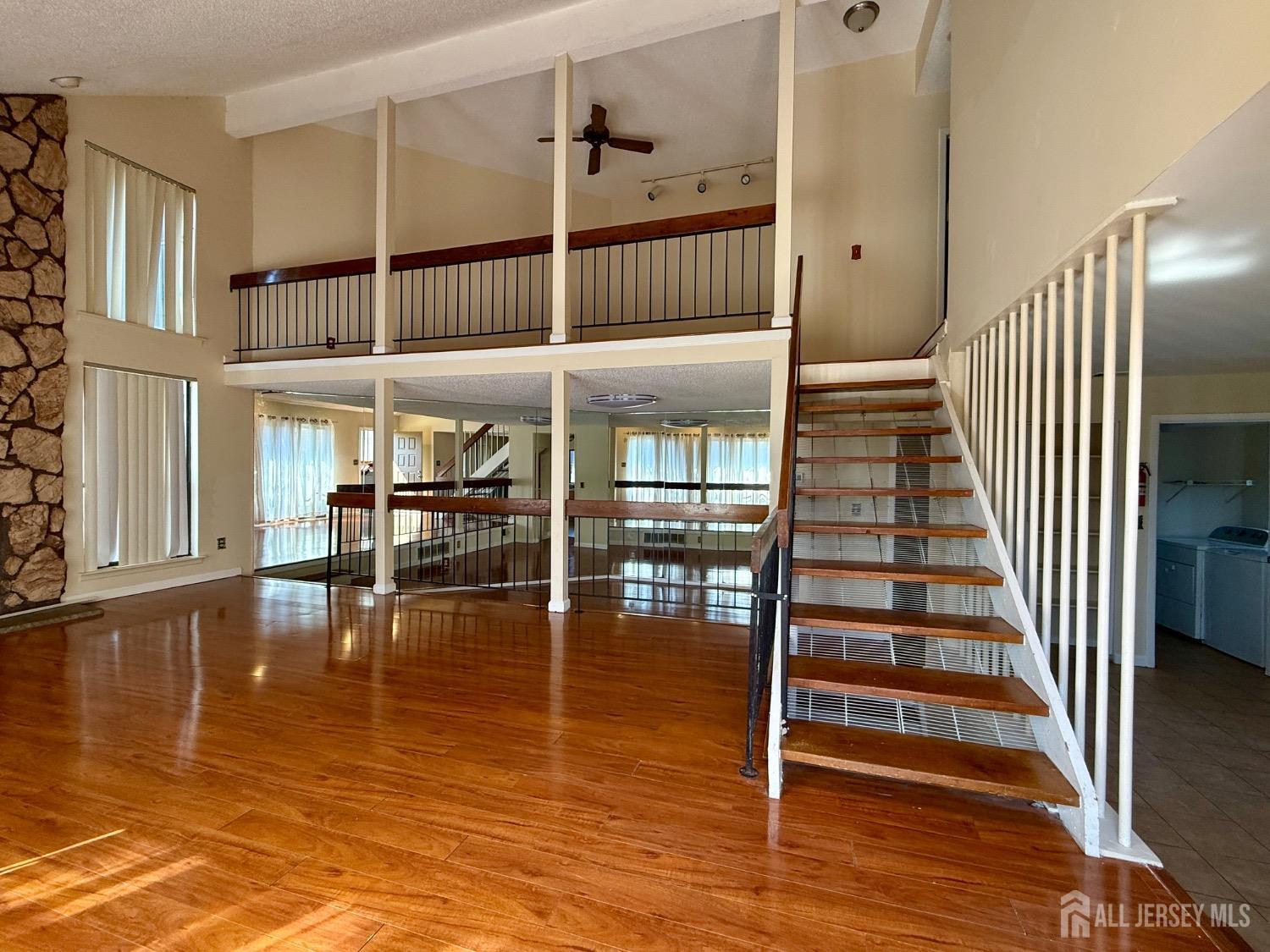 136 Westgate Drive Edison, NJ 08820 - Photo 8 of 17 a view of entryway and hall with wooden floor