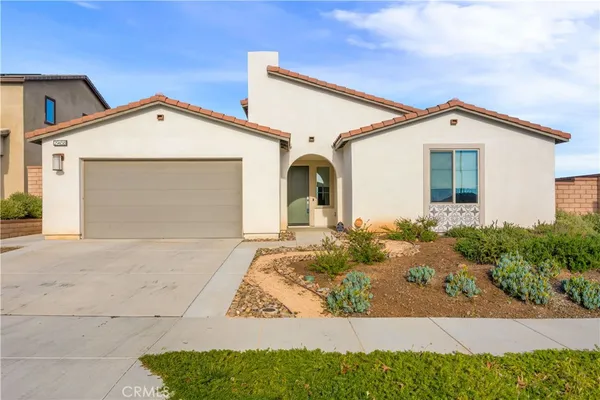 a front view of a house with garage