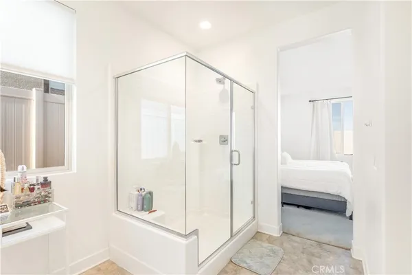 a bathroom with a shower and a tub