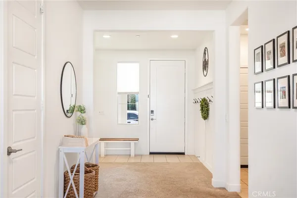 a view of an entryway with wooden floor