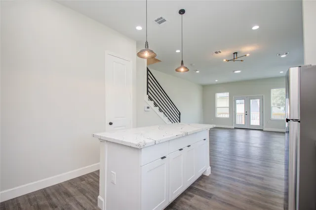 a view of an entryway with wooden floor