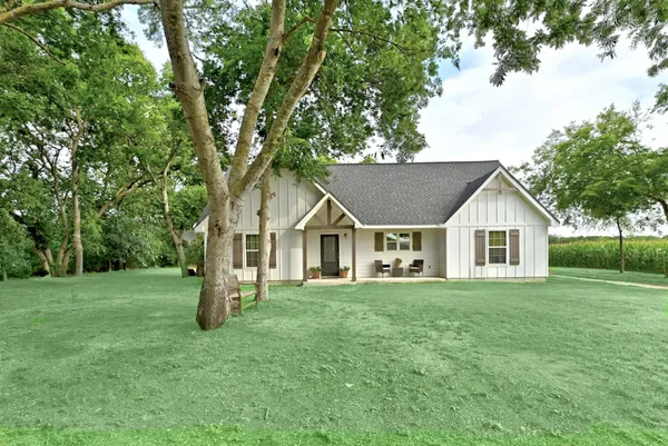 front view of a house with a yard