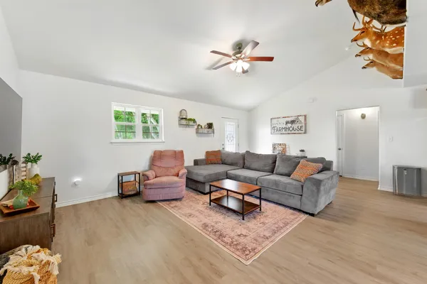 a living room with furniture and a window