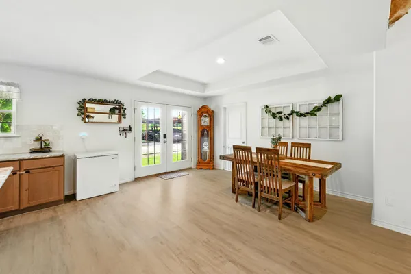 a kitchen with sink a stove and cabinets