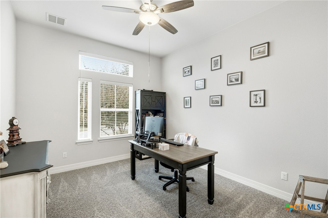 1209 Winding Way Drive Georgetown, TX 78628 - Photo 16 of 37 a living room with furniture and a window