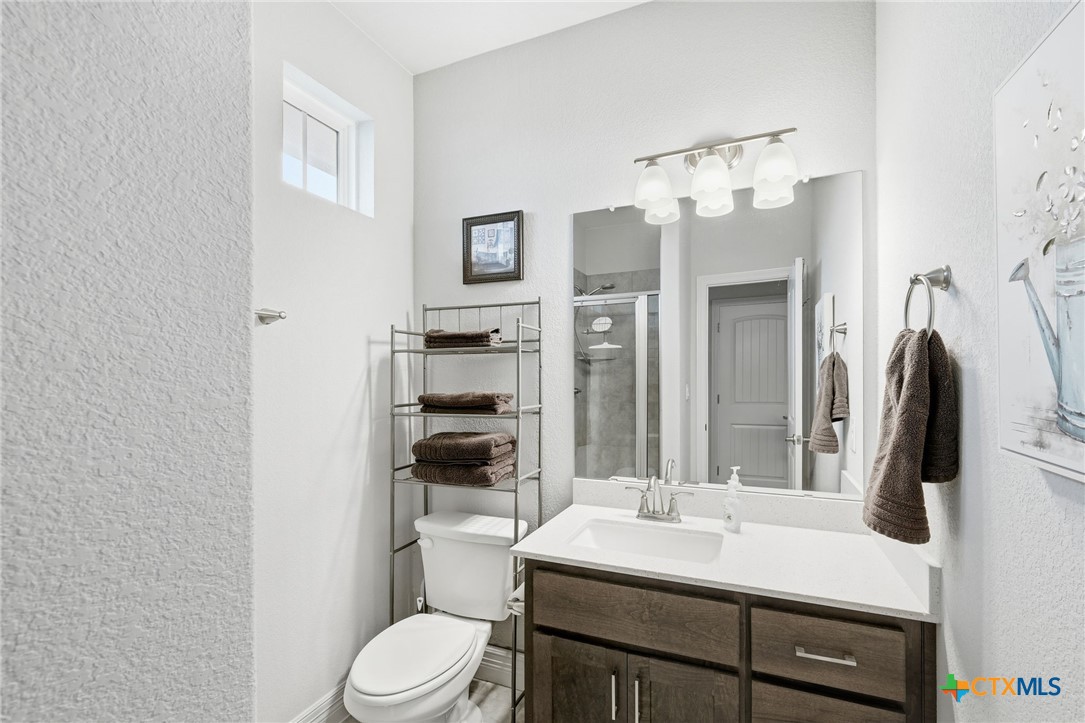 1209 Winding Way Drive Georgetown, TX 78628 - Photo 20 of 37 a bathroom with a sink a toilet and shower