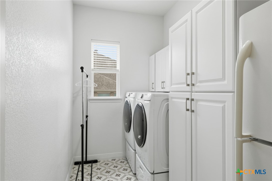 1209 Winding Way Drive Georgetown, TX 78628 - Photo 24 of 37 a utility room with dryer and washer