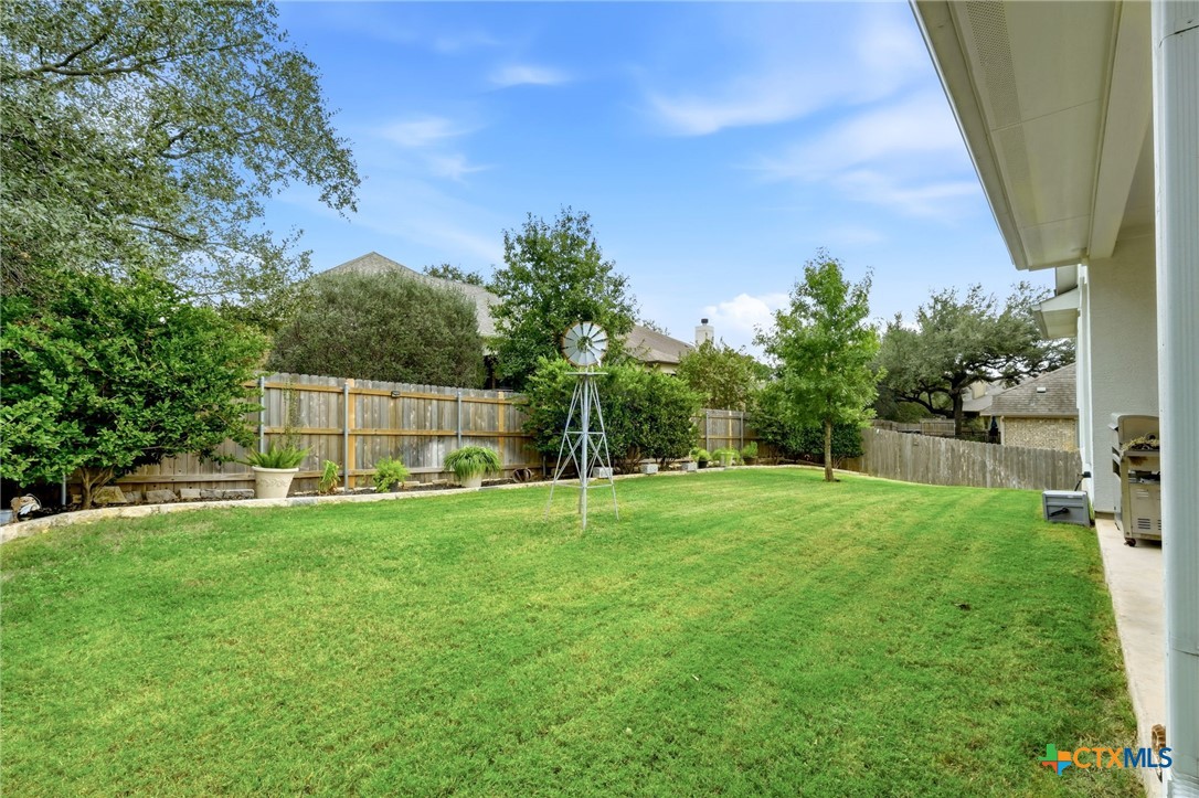 1209 Winding Way Drive Georgetown, TX 78628 - Photo 27 of 37 a house with green field in front of it