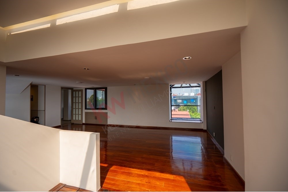 150 Viaducto Rio Becerra, Unit PH Alton Bay, CDMX 03810 - Photo 11 of 33 a view of livingroom with hardwood floor and window