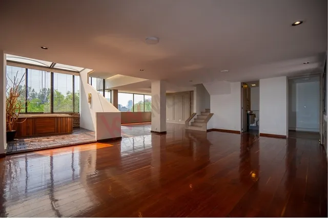 a living room with furniture window and wooden floor