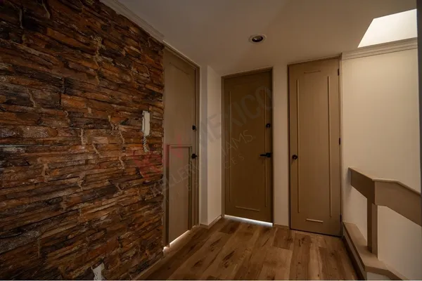 a view of hallway with wooden floor