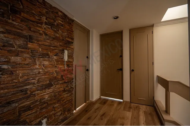 a view of hallway with wooden floor